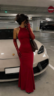 Female model wearing the Bordo Imperia halter maxi dress with matching long gloves
